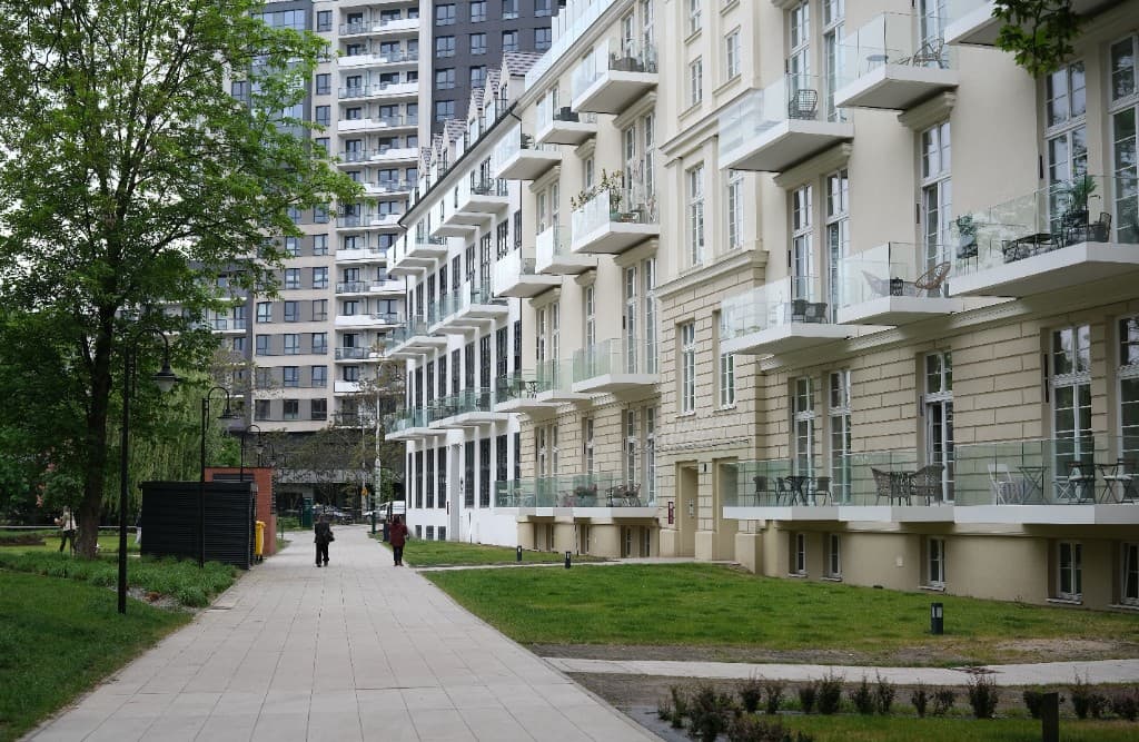 Modern apartment building with landscaped walkway